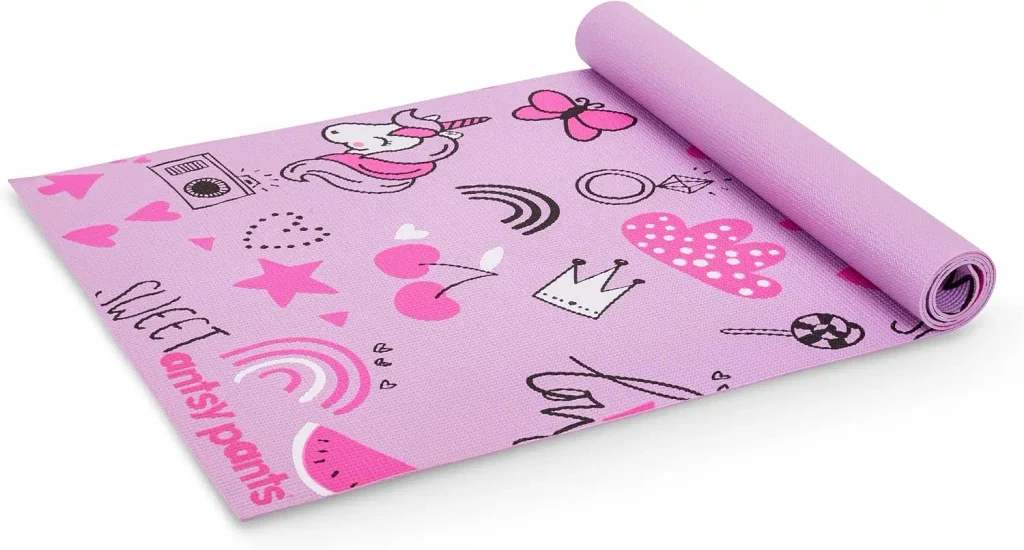 Pink unicorn print yoga mat for kids shown beside its roll.