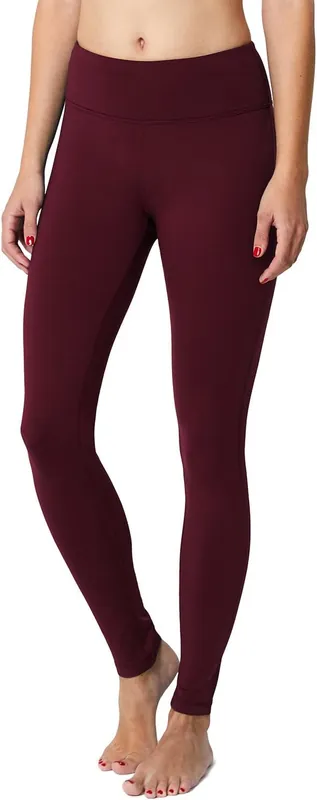 a model in solid wine colored high rise thermal leggings front view