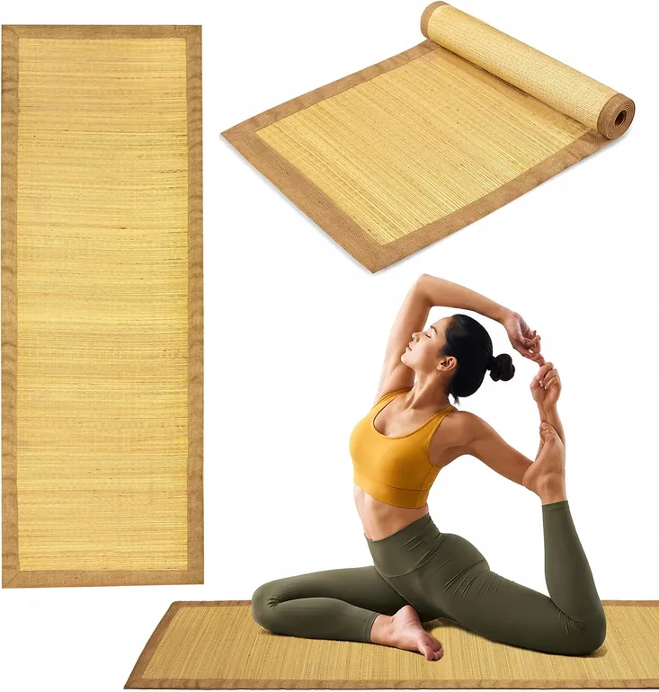 Pale woven grass yoga mat with dark jute edging, shown flat against white.