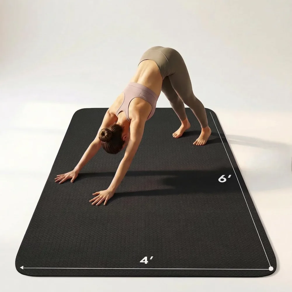 The FrenzyBird large yoga mat shown at its full six by four foot size during a home workout session.
