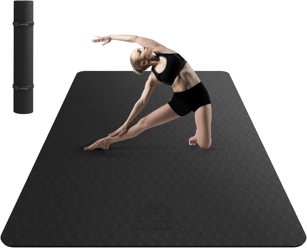 The HAPBEAR extra large yoga mat in black with water beading off its surface in an easy clean demonstration.