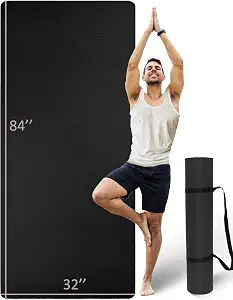An MRZZATA oversized yoga mat in grey shows its double-sided texture beside its neatly rolled form.