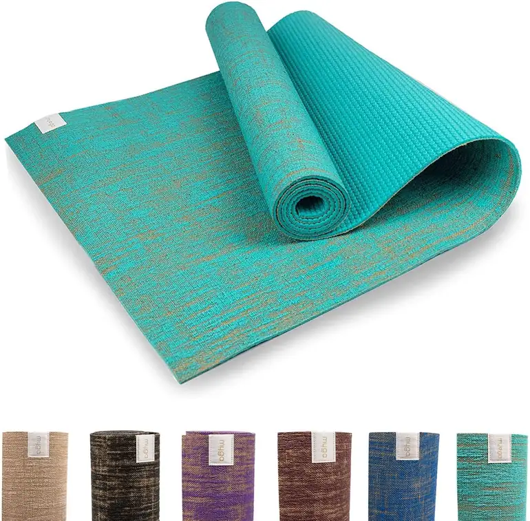 Two-tone jute Myga exercise mat with a dark backing strip along its edge.