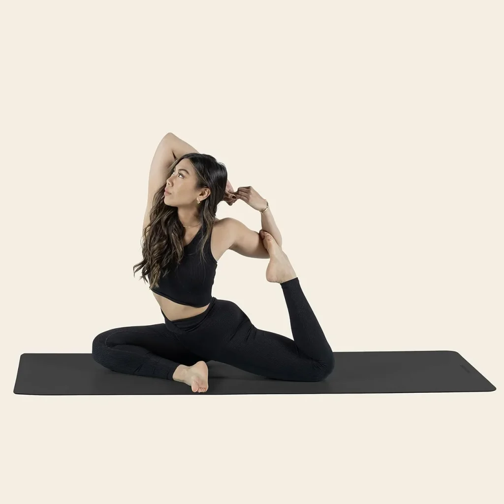 The Retrospec Laguna mat in black sits angled mid-roll against a clean white background.