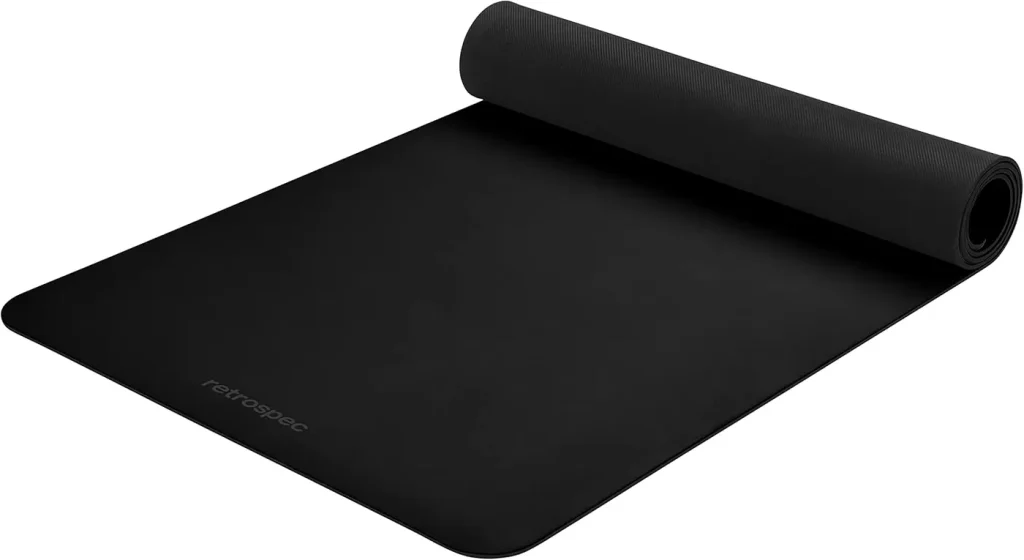 The Retrospec Laguna yoga mat in black shown flat and rolled as its main Amazon listing image.