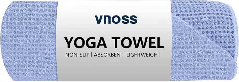 The Vnoss hot yoga towel rolled in blue with its brand band.